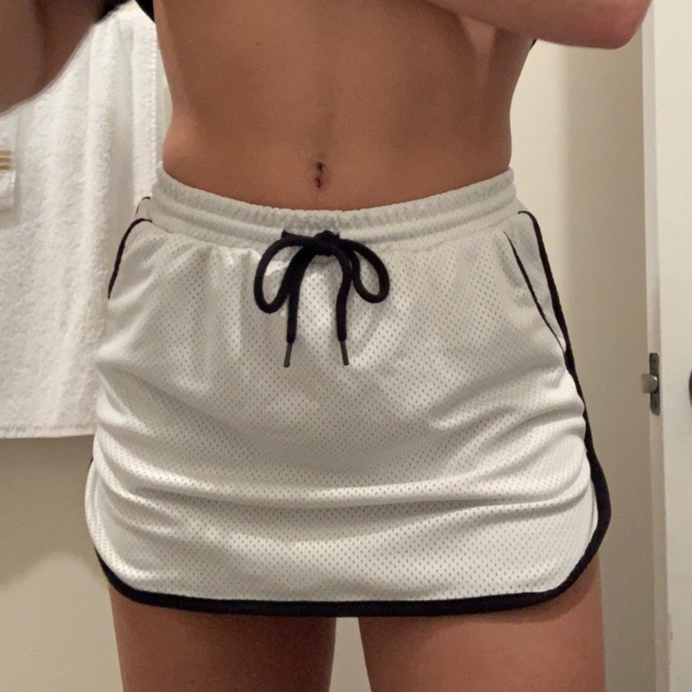 White and black mini tennis skirt